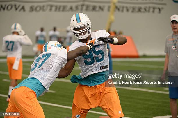 Dolphins defensive end Dion Jordan practices during Miami Dolphins training camp on July 27, 2013 in Davie, Florida.