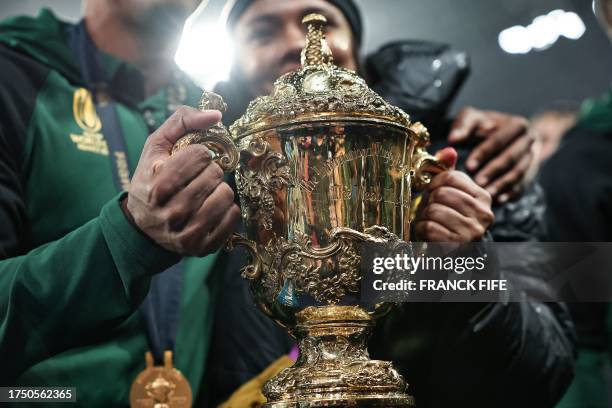 South Africa's team players celebrate with the Webb Ellis Cup after winning the France 2023 Rugby World Cup Final match between New Zealand and South...