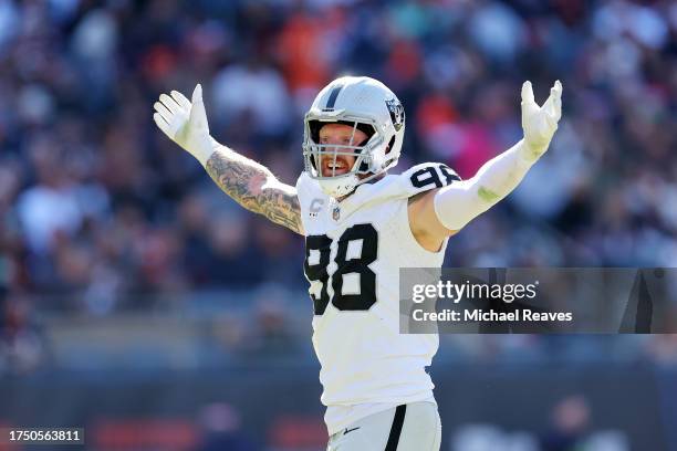 Maxx Crosby of the Las Vegas Raiders celebrates after a sack during the second quarter against the Chicago Bears at Soldier Field on October 22, 2023...