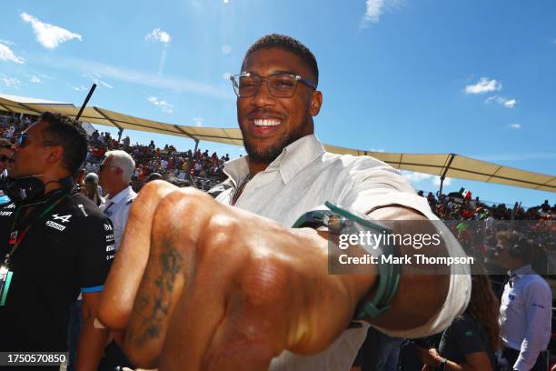 Anthony Joshua poses for a photo on the grid prior to the F1 Grand Prix of United States at Circuit of The Americas on October 22, 2023 in Austin,...