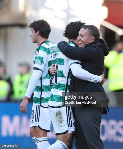 Tomoki Iwata of Celtic is seen with the manager Brendan Rodgers during the Cinch Scottish Premiership match between Heart of Midlothian and Celtic FC...