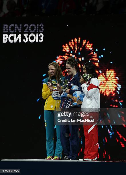 Missy Franklin of USA Emily Seebohm of Australia and Aya Terakawa of Japan pose with their medals from final of The Women's 100m Brackstroke at the...