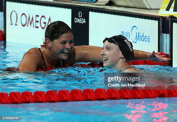 Lotte Friis of Denmark congartulates Katie Ledecky of USA who set a a new world record and wins the final of The Women's 1500m Freestyle at the Palau...