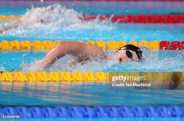 Katie Ledecky of USA on her way to winning the final of The Women's 1500m Freestyleat the Palau Sant Jordi on day eleven of the 15th FINA World...