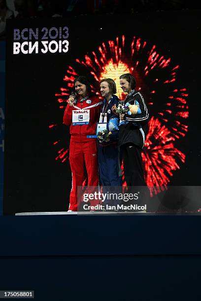 Katie Ledecky of USA who set a new world record and won the final of The Women's 1500m Freestyle with Lotte Friis of Denmark and Lauren Boyle of New...