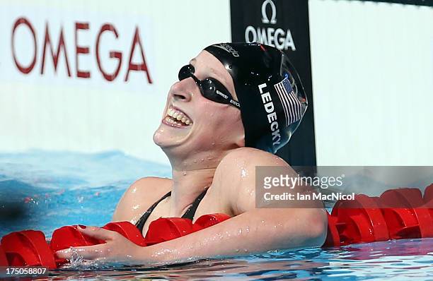 Katie Ledecky of USA set a new world record and wins the final of The Women's 1500m Freestyle at the Palau Sant Jordi on day eleven of the 15th FINA...