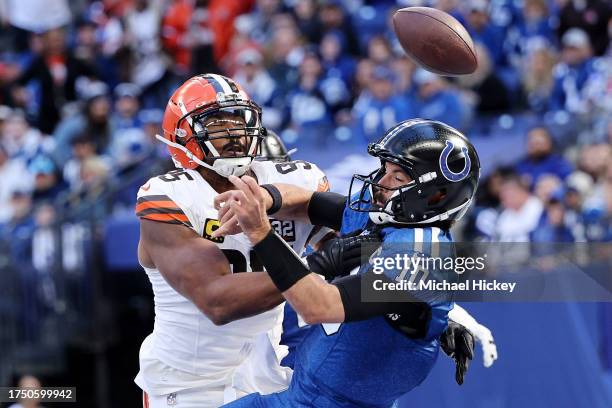 Gardner Minshew of the Indianapolis Colts fumbles the ball against Myles Garrett of the Cleveland Browns during the second quarter at Lucas Oil...