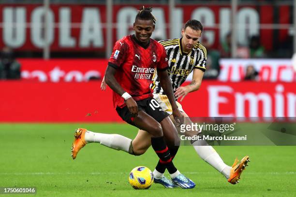 Rafael Leao of AC Milan on the ball whilst under pressure from Federico Gatti of Juventus during the Serie A TIM match between AC Milan and Juventus...
