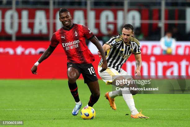 Rafael Leao of AC Milan on the ball whilst under pressure from Federico Gatti of Juventus during the Serie A TIM match between AC Milan and Juventus...