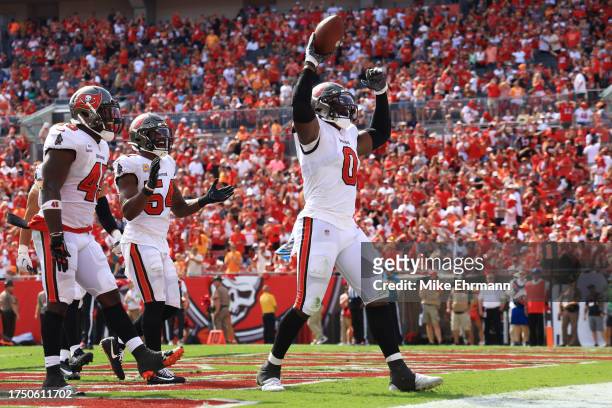 Yaya Diaby of the Tampa Bay Buccaneers recovers a fumble in the third quarter of the game against the Atlanta Falcons at Raymond James Stadium on...