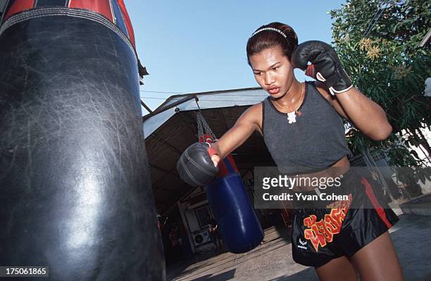 Transvestite boxer Parinya Kiatbusaba in training at the Paiyanan boxing camp in Cholburi province. Parinya has since had a sex-change operation and...