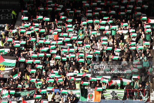 Celtic supporters show their support with Palestine flags during the Cinch Scottish Premiership match between Heart of Midlothian and Celtic FC at...