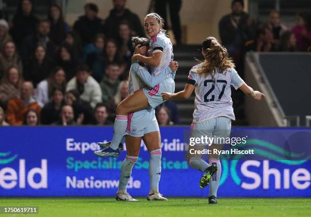 Katie McCabe of Arsenal celebrates with team mates after scoring the team's second goal during the Barclays Women´s Super League match between...