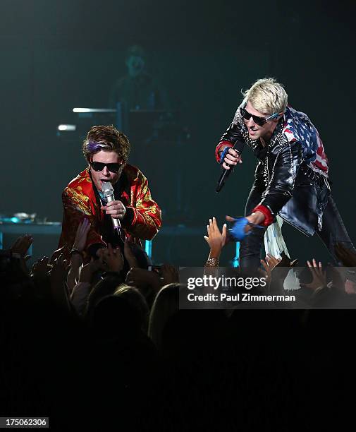 Singers Nash Overstreet and Ryan Follese of band Hot Chelle Rae perform at the Prudential Center on July 30, 2013 in Newark, New Jersey.