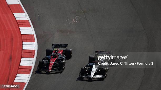 Zhou Guanyu of China driving the Alfa Romeo F1 C43 Ferrari and Yuki Tsunoda of Japan driving the Scuderia AlphaTauri AT04 battle for position during...