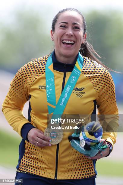 Mariana Pajon of Team Colombia celebrates her gold medal in the podium of Women's BMX Racing at Parque Peñalolen on Day 2 of Santiago 2023 Pan Am...