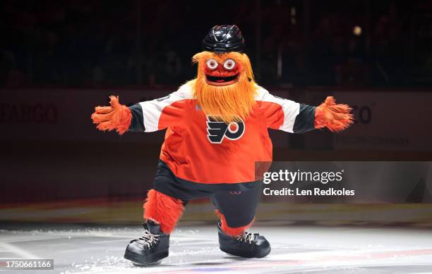 Gritty the mascot of the Philadelphia Flyers skates at center ice prior to an NHL game against the Vancouver Canucks at the Wells Fargo Center on...