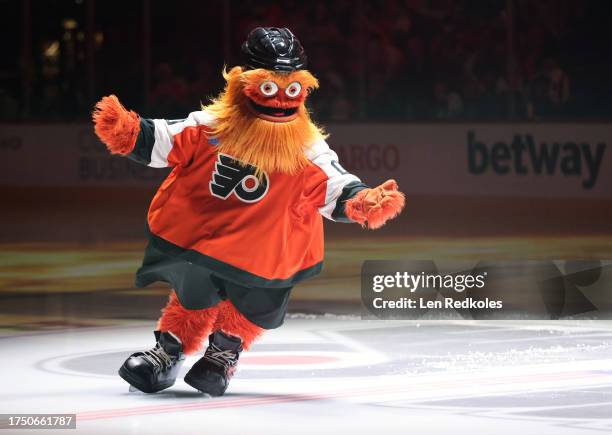 Gritty the mascot of the Philadelphia Flyers skates at center ice prior to an NHL game against the Vancouver Canucks at the Wells Fargo Center on...