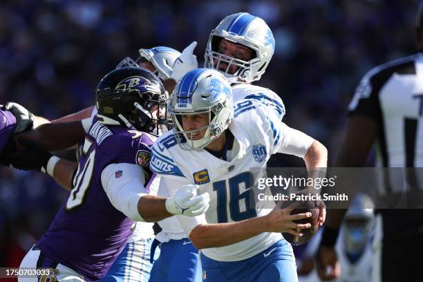 Jared Goff of the Detroit Lions is hit by Kyle Van Noy of the Baltimore Ravens as he scrambles with the ball in the second half of the gameat M&T...