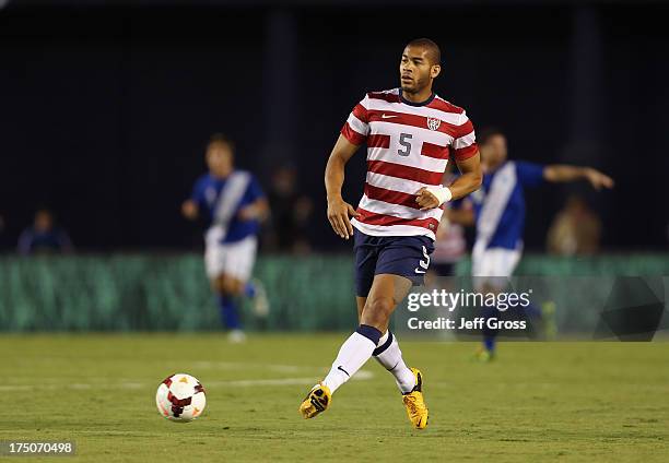 Oguchi Onyewu of the USA passes the ball against Guatemala at Qualcomm Stadium on July 5, 2013 in San Diego, California.