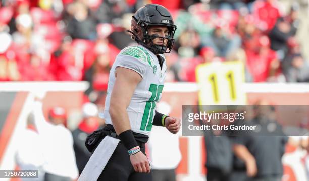 Bo Nix of the Oregon Ducks looks to the sideline for a play during the second half of their game against the Utah Utes at Rice Eccles Stadium on...