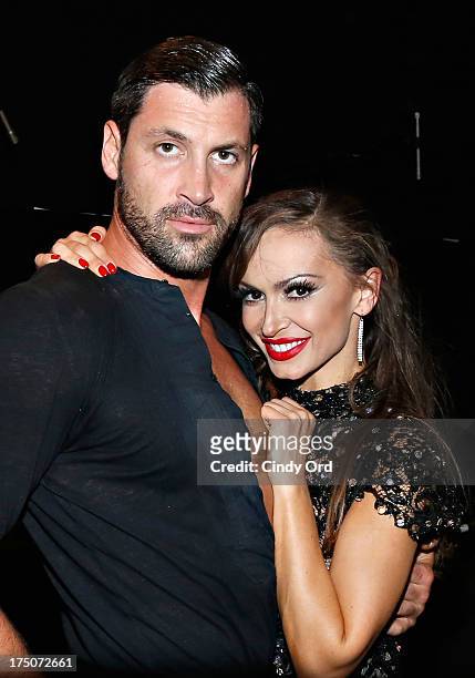 Dancers Maksim Chmerkovskiy and Karina Smirnoff pose backstage following their performance of "Forever Tango" at the Walter Kerr Theatre on July 30,...