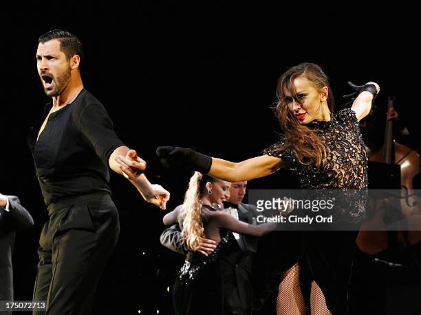 Dancers Maksim Chmerkovskiy and Karina Smirnoff take part in the "Forever Tango" Curtain Call at Walter Kerr Theatre on July 30, 2013 in New York...