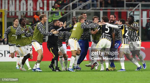 Manuel Locatelli of Juventus celebrates with team mates after scoring the team's first goal during the Serie A TIM match between AC Milan and...