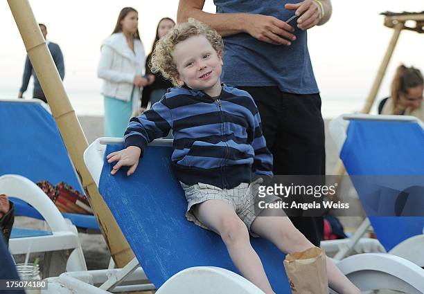 Henry Story Driver attends the Sustainable Surf and LA Waterkeeper Benefit with his mother Minnie Driver at Paradise Cove Beach Cafe on July 30, 2013...