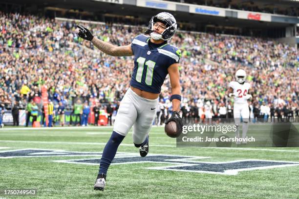 Jaxon Smith-Njigba of the Seattle Seahawks scores a touchdown in the first quarter of the game against the Arizona Cardinals at Lumen Field on...