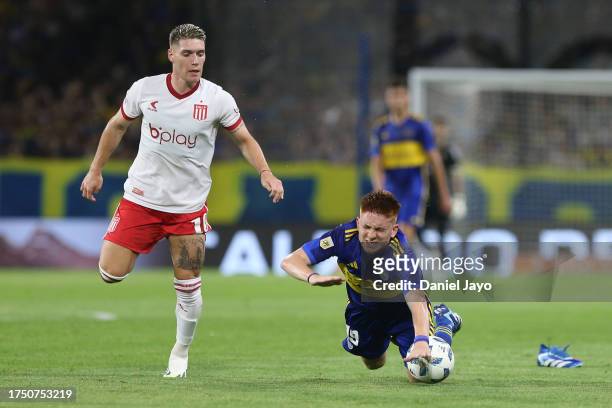 Valentin Barco of Boca Juniors is fouled by Benjamin Rollheiser of Estudiantes during a match between Boca Juniors and Estudiantes as part of Group B...