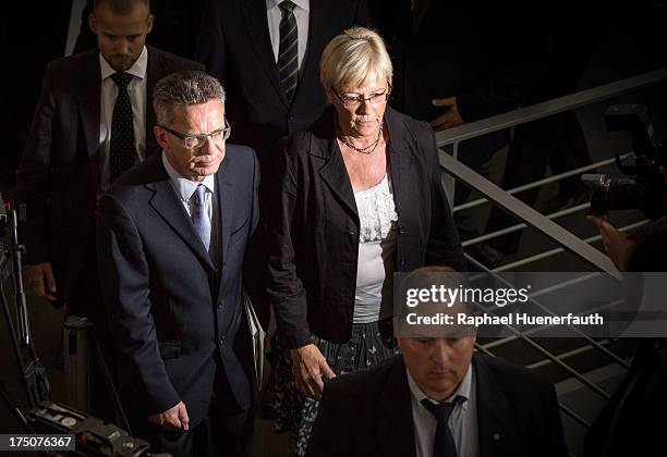 German Defence Minister Thomas de Maiziere joins committee chairperson Susanne Kastner to answer questions from parliamentarians at the Bundestag...