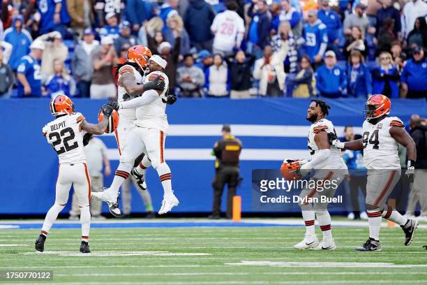 Za'Darius Smith of the Cleveland Browns celebrates with teammates after forcing a fumble during the fourth quarter at Lucas Oil Stadium on October...