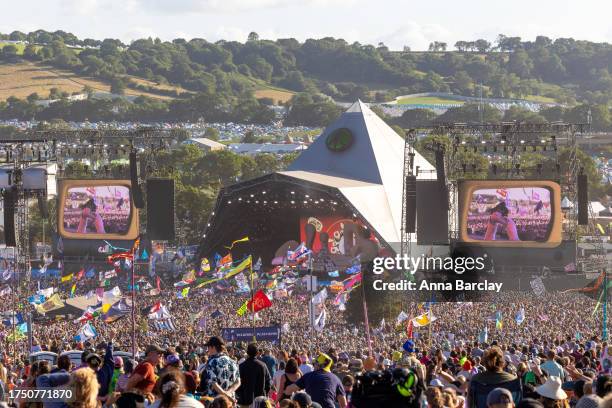 The crowd gathers to watch Elton John perform on the main Pyramid Stage on Day 5 of the Glastonbury Festival 2023 held at Worthy Farm, Pilton on June...