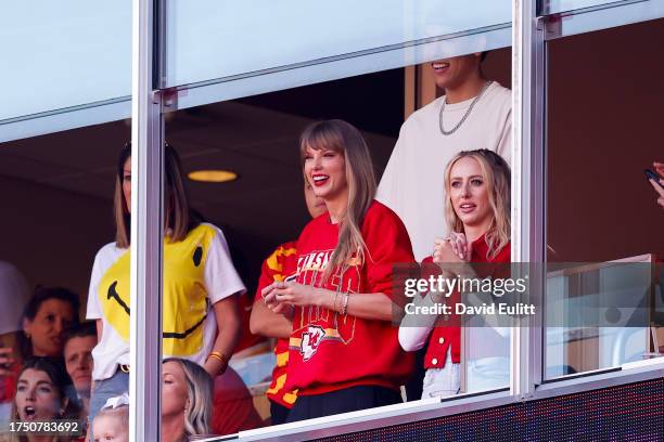 Taylor Swift and Brittany Mahomes look on during the first half of the game between the Los Angeles Chargers and Kansas City Chiefs at GEHA Field at...