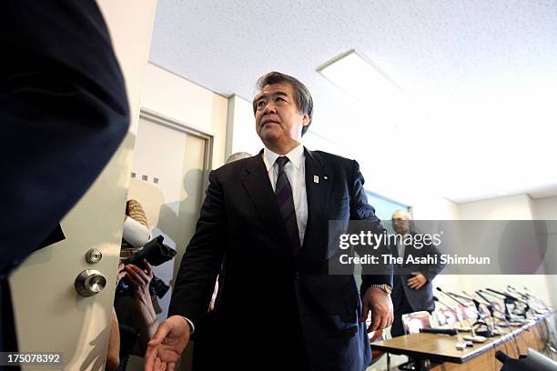 All Japan Judo Federation chief Haruki Uemura leaves after a press conference on their resignation in August at Kodokan on July 30, 2013 in Tokyo,...
