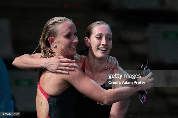 Jessica Hardy and Breeja Larson of USA hug after competing during the Swimming Women's 100m Freestyle final on day eleven of the 15th FINA World...