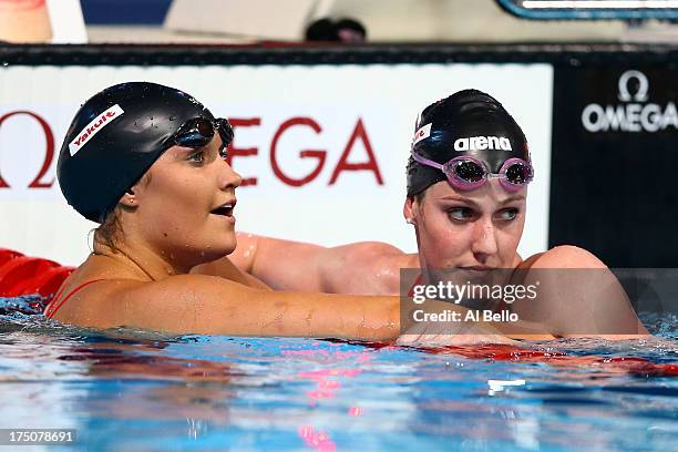 Elizabeth Pelton of USA hugs Missy Franklin of USA after competing during the Swimming Women's 100m Backstroke final on day eleven of the 15th FINA...