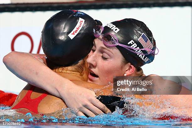 Elizabeth Pelton of USA hugs Missy Franklin of USA after competing during the Swimming Women's 100m Backstroke final on day eleven of the 15th FINA...