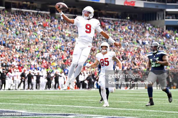 Joshua Dobbs of the Arizona Cardinals scores a touchdown in the second quarter of the game against the Seattle Seahawks at Lumen Field on October 22,...