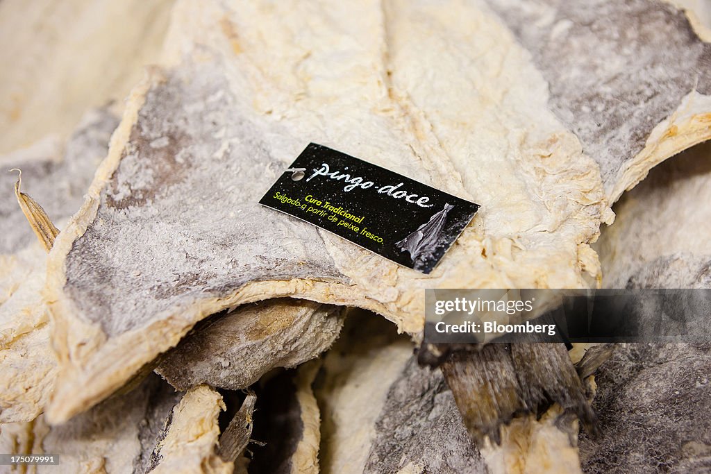 Pingo Fish A sign sits on a display of salted cod fish for sale inside a Pingo ...