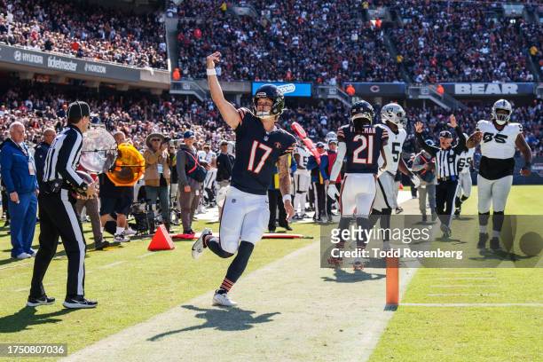 Quarterback Tyson Bagent of the Chicago Bears gestures to the fans during an NFL football game against the Las Vegas Raiders at Soldier Field on...