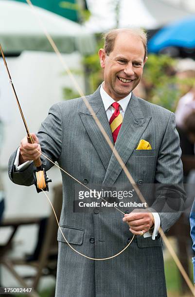 Prince Edward, Earl of Wessex tries his hand at fly fishing during a to visit the New Forest and Hampshire county show at The Showground, New Park on...