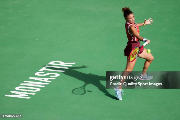 Jasmine Paolini of Italy plays a forehand shot against Elise Mertens of Belgium in her Final match during day seven of the Jasmin Open Monastir at...