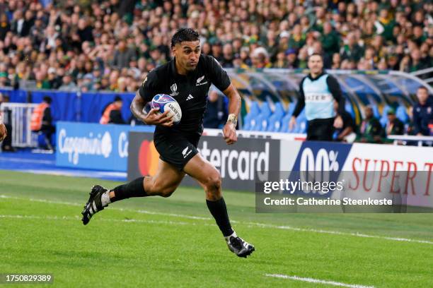 Rieko Ioane of New Zealand runs with the ball during the Rugby World Cup Final match between New Zealand and South Africa at Stade de France on...