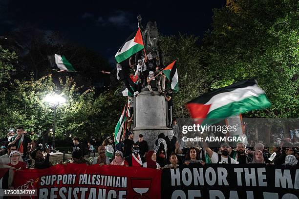 People take part in a protest in support of the Palestinian people in New York on October 28, 2023. Thousands of civilians, both Palestinians and...
