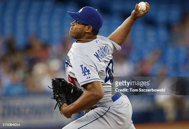 Carlos Marmol of the Los Angeles Dodgers delivers a pitch during MLB game action against the Toronto Blue Jays on July 23, 2013 at Rogers Centre in...
