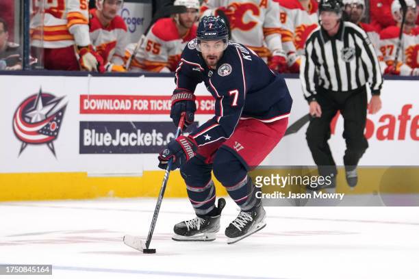 Sean Kuraly of the Columbus Blue Jackets skates with the puck during the second period `av at Nationwide Arena on October 20, 2023 in Columbus, Ohio.