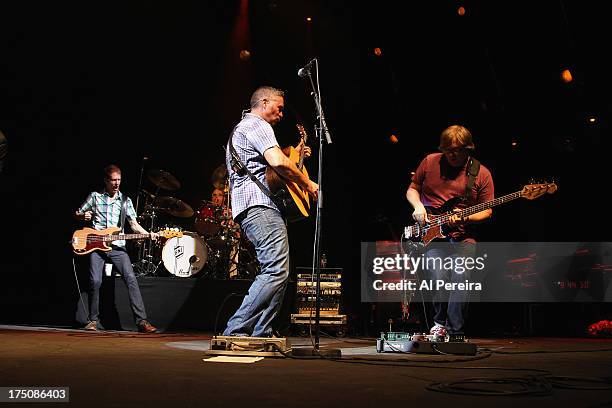 Ed Robertson and Jim Creegan of Barenaked Ladies and Robert Sledge of Guster perform when the Barenaked Ladies headline a benefit concert for...