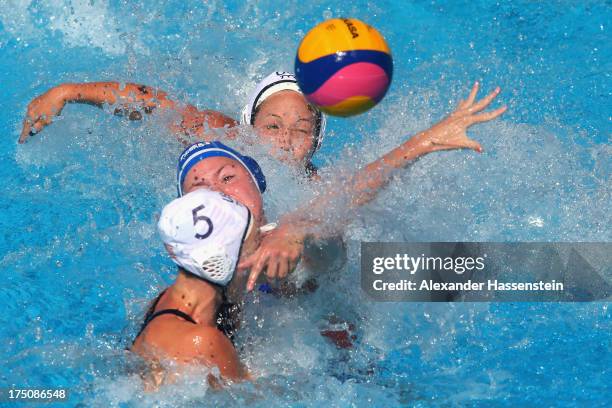 Courtney Mathewson of USA and her team mate Caroline Clark in action with Vivian Sevenich of Netherlands during the Women's Water Polo classification...